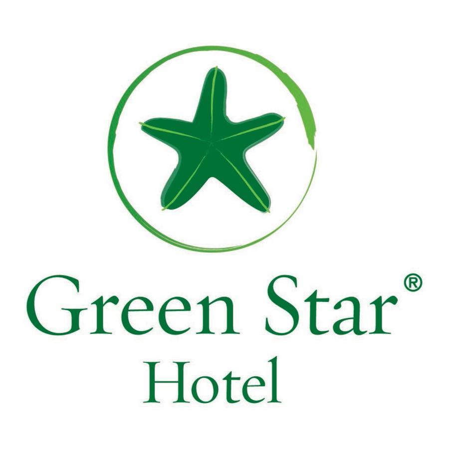 Safir Hotel Cairo Giza Екстериор снимка The image shows the logo of "Green Star Hotel." It features a green star, likely a stylized sea star, positioned above the text. The name "Green Star" is displayed prominently, with "Hotel" underneath it, all in a clean and simple font. The overall d